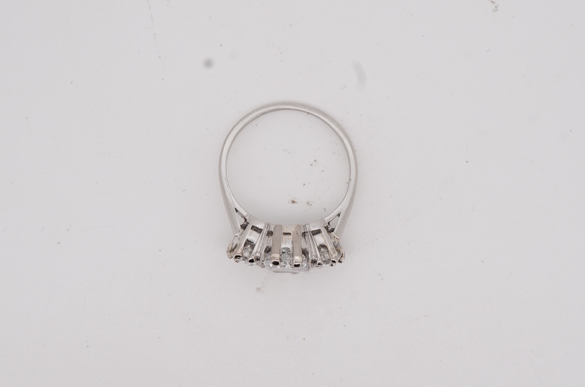 A diamond ring, set with a cushion-shaped diamond weighing 1.50 carats, between shoulders set with brilliant-cut diamonds totalling approximately 0.40 carats, size K, gross weight approximately 4 grams, Condition: centra